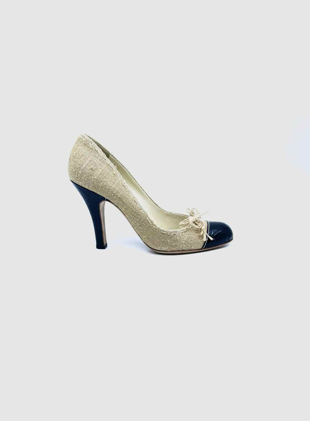 PRADA Size 9 Black, beige Canvas Solid Pumps