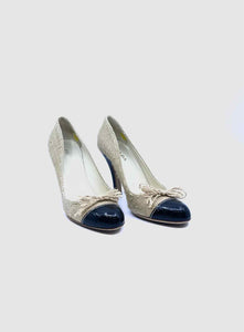 PRADA Size 9 Black, beige Canvas Solid Pumps